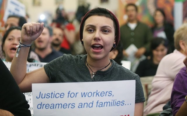 NEW YORK, NY - JANUARY 29:  Undocumented immigrant Katherine Taberes, originally from Colombia, cheers during a watch party of President Barack Obama's speech on immigration on January 29, 2013 in New York City. Obama called for immigration reform and a "pathway to citizenship" for the nation's 11 million undocumented immigrants.  (Photo by Mario Tama/Getty Images)