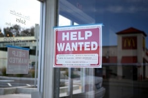 A red "help wanted" sign on a store window. Source: CBS Sacramento