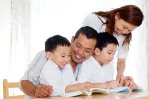 Family reading together happily