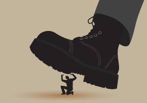 Cartoon of a huge boot about to step on a person