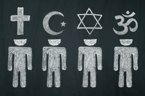 On a chalkboard, people are drawn with their heads representing some major world religions: Christianity, Islam, Judaism, and Hinduism.