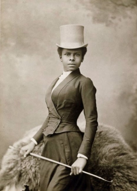 Studio portrait of an African American woman equestrian rider from the late 1880s.