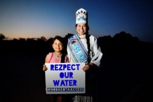 The author's daughter, Kimimila, and the author's sister, Ta'Sheena, who is the reigning Miss Indian World and a citizen of the Standing Rock Sioux Tribe, support the anti-pipeline efforts in North Dakota. For more information, visit www.rezpectourwater.com.