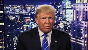 Donald Trump on a cityscape background, a screenshot from his apology video.