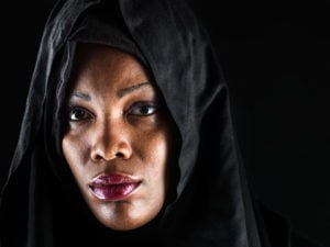Headshot of a person wearing a hijab while looking at the camera 