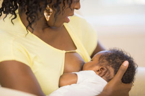 Person breastfeeding their baby