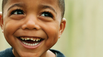 Young child with a huge smile