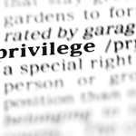 Close-up of the dictionary definition of "privilege"
