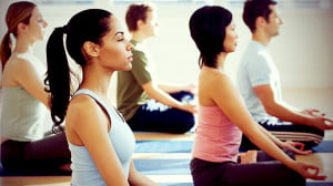 People meditating in a yoga class