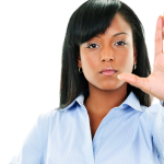 Person with their hand up as if saying "Stop"