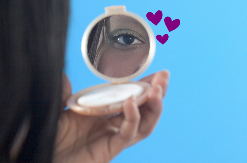 Person looking in compact mirror