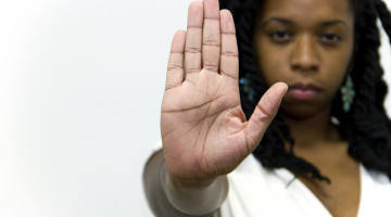 Person holding up their hand, as if to say "Stop"