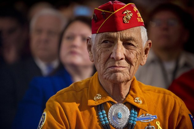 American member of the Navajo Code Talkers, Roy Hawthorne, listen as US President Barack Obama speaks during the White House Tribal Nations Conference at the Department of the Interior in Washington, DC.