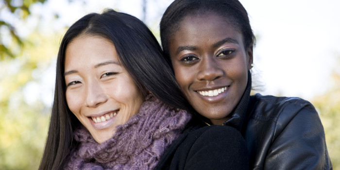 A couple, standing smiling in the cold weather.