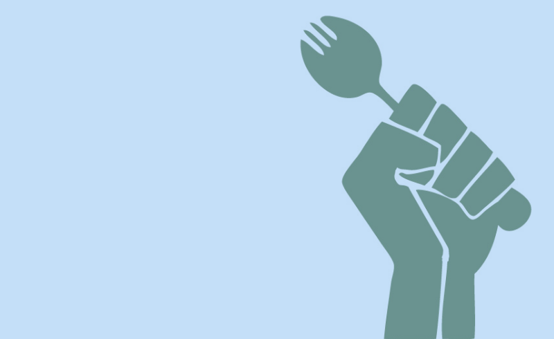 The Black power symbol of a fist, holding a fork