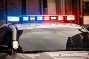 LED light bar on police cruiser flashing red and blue emergency lights