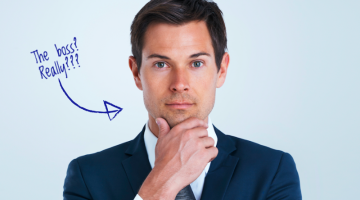 A person in a suit with an arrow pointing to them, asking, "The boss? Really???"