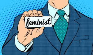 Classic comic style illustration of a person in a suit and tie holding a placard that reads, "Feminist."
