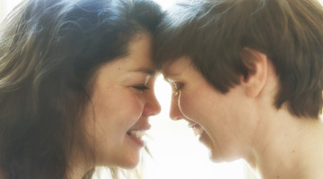 A couple smiling with their heads together