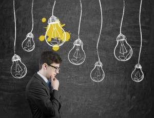 Businessperson thinking with lightbulb over head
