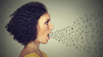 Person talking, with alphabet letters coming out of their mouth