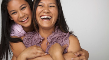 A parent and child, laughing