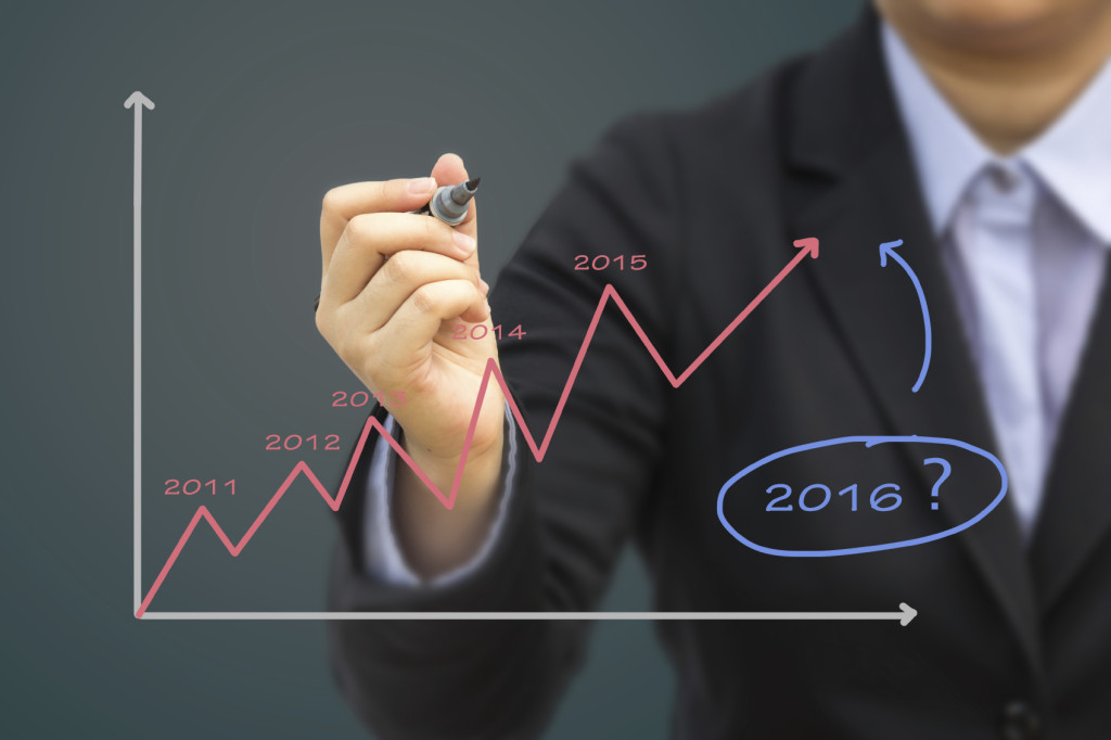 Businessperson is writing down potential earnings for 2016